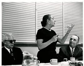Rachel Korn addressing members of meeting, L. R. J. Gladstein and A. Trapunsky also present, Jewish Public Libary.