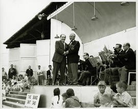 Maurice Zbriger greeting unidentified military figure at "Band Unit 340" military concert