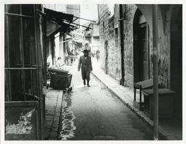 Exterior shot of an Orthodox man on a street in Mea Shearim