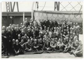 Sybil Gittelson and Harris Beecher posing with fellow passengers of ship bound for Europe