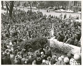 Full shot of street crowd and laying of cornerstone, dedication ceremony for new library building (at 4499 Esplanade), Jewish Public Library.